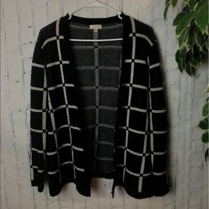 Women’s black and white sweater.